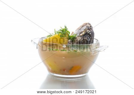 Vegetable Soup With Fish In A Glass Bowl On A White Background