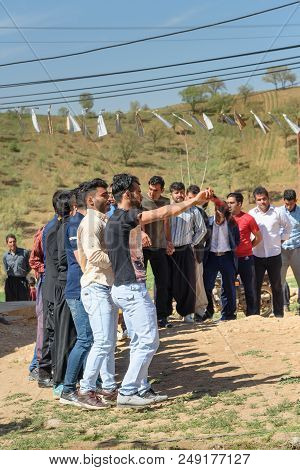 Lorestan Province, Iran - April 1, 2018: Iranian Men Dansing Lurish Cupi Dances On Wedding Ceremony 
