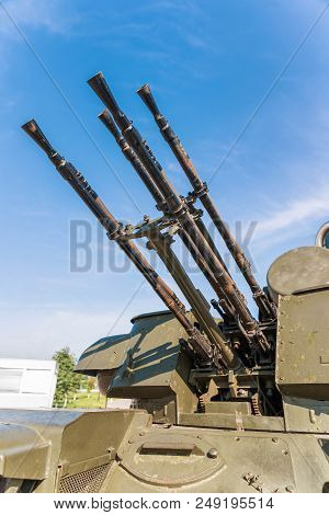 Guns Of A Tank In A Blue Sky, Close-up. Military Equipment.
