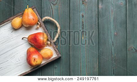Fresh Fruit On A White Wooden Tray: Banatas, Pears, Apricots. Countryside Setting. Top View. Copy Sp