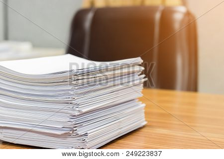 Stack Of Student's Homework That Assigned To Students To Be Completed Outside The Class On Teacher's