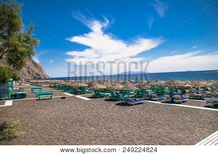 Permissa black sand beach in Santorini. Greece. 