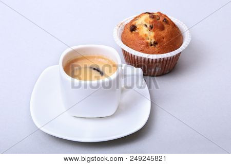 Classic Espresso In White Cup With Homemade Cake And Chocolate On White Background