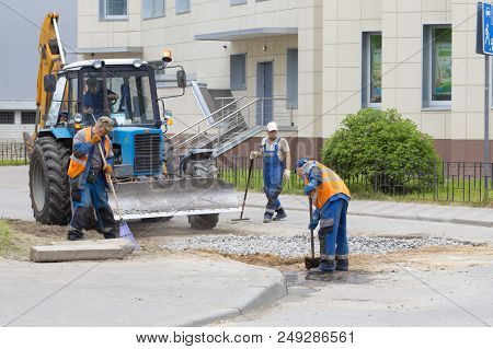 Road Works, Closing Holes In Asphalt And Workers June 2, 2018, Russia, Leningrad Region City Of Kiro