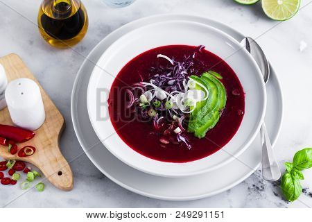 Beetroot Gazpacho Soup With Blue Cabbage, Avocado And Green Onio