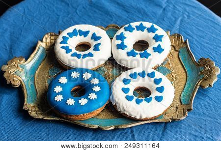 Homemamde Doughnuts Decorated With White And Blue Sugarpaste