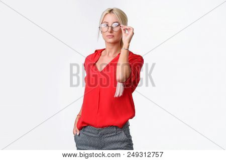 Portrait Of A Young Business Woman In A Business Suit And Glasses On An Isolated White Background