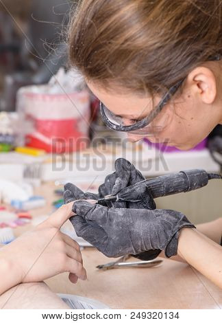 Manicurist At Work, Painting Nails In Nail Salon, Uv Lap Of Quick Dry Nail Polish Manicure, Focus On