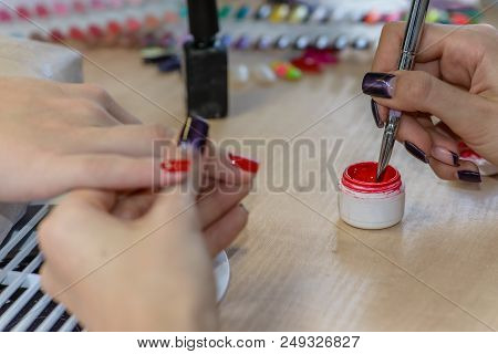 Painting Nails In Nail Salon, Uv Lap Of Quick Dry Nail Polish Manicure, Focus On Brush