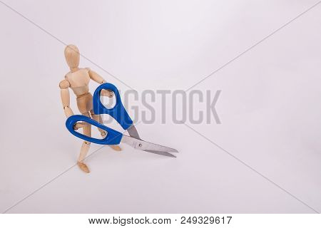 Wooden Jointed Manikin Doll Figure Holding Sewing Scissors On White Background