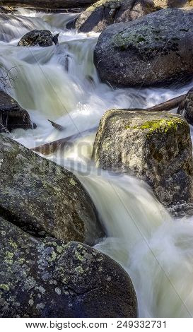 St. Vrain Creek During Spring Melt Flowing Through Rocks And Boulders