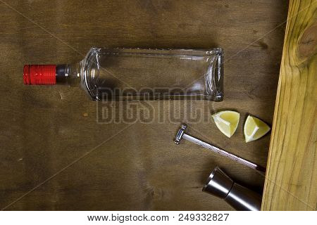 Bottle With Strong Alcohol On A Wooden Background