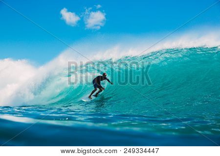 July 7, 2018. Bali, Indonesia. Surfer Ride On Big Barrel Wave At Padang Padang. Professional Surfing