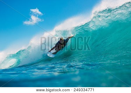 July 7, 2018. Bali, Indonesia. Surfer Ride On Big Barrel Wave At Padang Padang. Professional Surfing