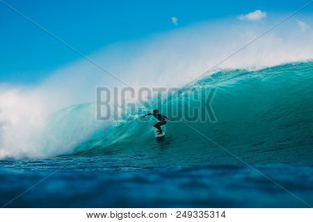 July 7, 2018. Bali, Indonesia. Surfer Ride On Big Barrel Wave At Padang Padang. Professional Surfing