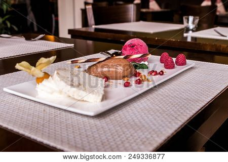 Piece Of Brown Mousse A U Chocolate Sweet Dessert And Decoration On A White Plate Background