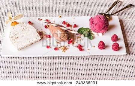 Piece Of Brown Mousse A U Chocolate Sweet Dessert And Decoration On A White Plate Background