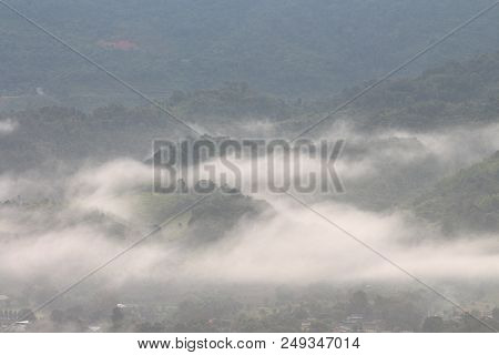 Rock Mountain Protruding From Rice Field. Morning Fog On Sunrise In The Phulanka, Phayao Thailand.