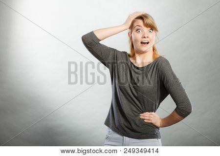 Surprise And Good Shock. Expressive Happy Charming Female Portrait. Excited Girl With Hand On Her He