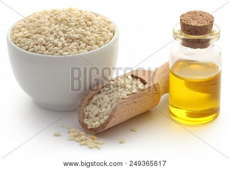 Peeled Sesame Seeds With Oil Over White Background