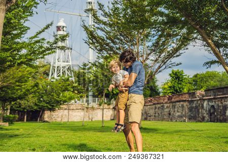 Dad And Son On Background Of Fort Cornwallis In Georgetown, Penang, Is A Star Fort Built By The Brit