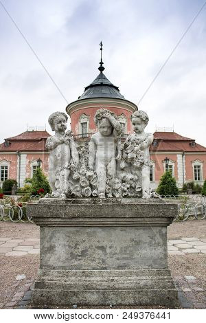 Zolochiv, Ukraine - June 02 2018: Photo Of Statue Of Three Boys In The Garden Of The Castle In Zoloc