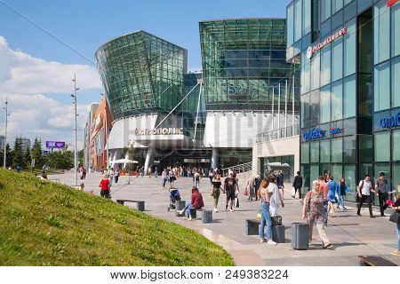 Moscow, Russia - July 13, 2018: Many People Walking Near Metropolis Shopping Mall Building On Lening