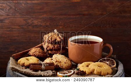 Cookies With Cinnamon And Two Cups Of Tea On A Burlap Napkin, Selective Focus, Close-up, Top View. D