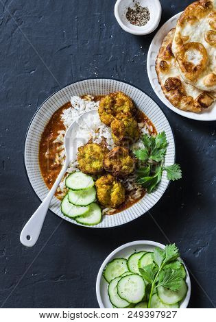 Bottle Gourd And Zucchini Fritters With Rice And Curry Sauce. Healthy Vegetarian Food On Dark Backgr