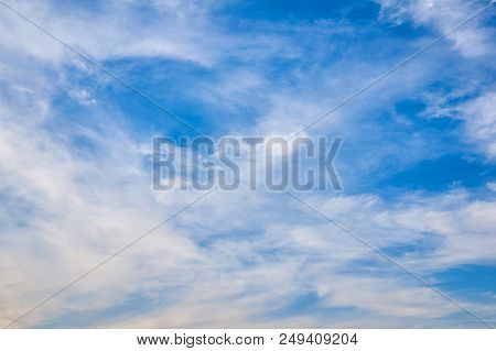 Beautiful Blue Sky With Fleecy Clouds. Abstract Background.