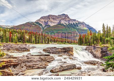 Athabasca Falls In Autumn Colors At Jasper National Park On The Icefields Parkway In Alberta, Canada