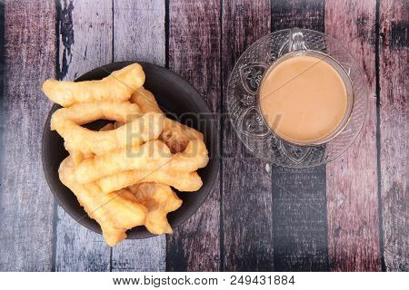 Ready Served Of A Cup Of Coffee And Patongko (deep-fried Dough Stick)