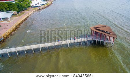 Sipitang,sabah-july 6,2018:aerial View Of The Wooden Pier Or Jetty With Hut At Esplanade In Sipitang