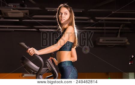 Sport, Fitness, Lifestyle And People Concept - Close Up Of Young Woman Flexing Muscles On Cable Gym 