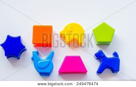Set Of Toys For Babies On A White Table