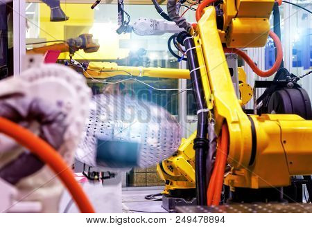 Industrial Line With Robots On The Sides, Production And Processing Of Metal Parts, Slective Focus