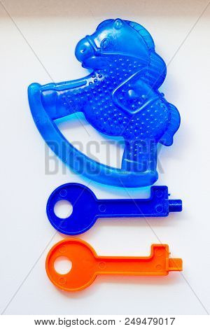 Set Of Toys For Babies On A White Table