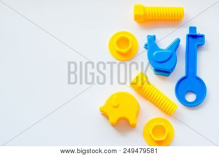 Set Of Toys For Babies On A White Table