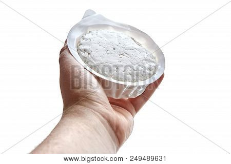 Cottage Cheese In Plastic Packaging Lying On The Hand . Isolated On White Background. Curd - Dairy, 