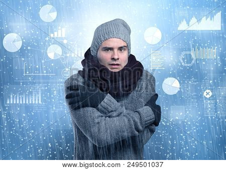 Young businessman shivering with graphs, reports and chart concept