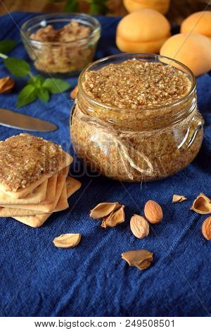 Urbech Of Apricot Kernels In A Glass Jar And On A Cracker