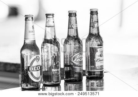 Great Stirrup Cay, Bahamas - January 08, 2016: Beer In Glass Bottles On Bar Counter. Alcohol Bad Hab