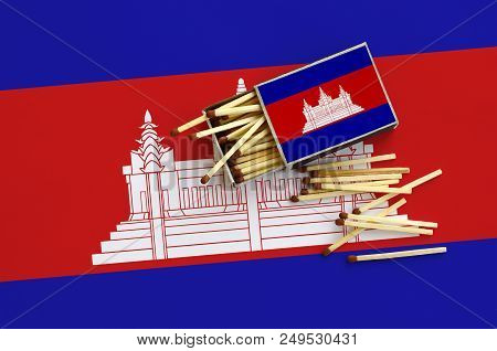 Cambodia Flag  Is Shown On An Open Matchbox, From Which Several Matches Fall And Lies On A Large Fla