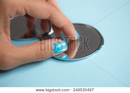 Compact Mirror In Women's Hands With Manicure . Makeup Female Accessories