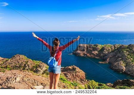Tourist Woman With Backpack On Cap De Creus, Natural Park. Eastern Point Of Spain, Girona Province, 
