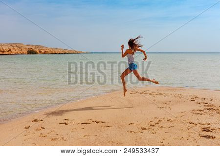 Tourist Woman At The Red Sea Coast In The Ras Mohammed National Park. Famous Travel Destionation In