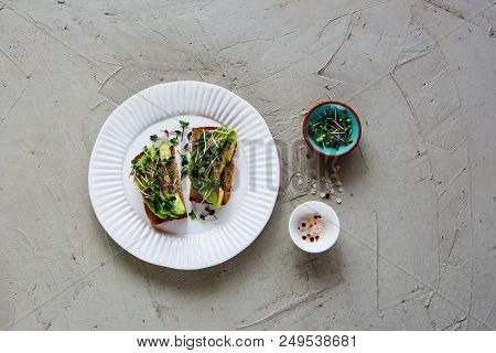 Flat-lay Of Balanced Vegan Breakfast Or Lunch. Delicious Avocado Toasts On Plate With Micro Greens O