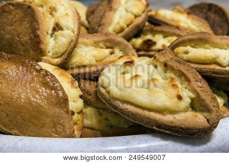 Puff Pastry With Cheese On A Wooden Background. Homemade Baking Pies.