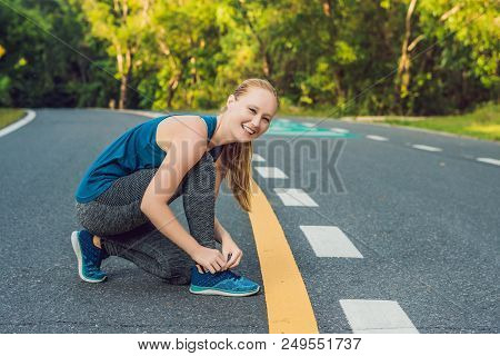 Female Runner Tying Her Shoes Preparing For Jogging Outside .young Girld Runner Getting Ready For Tr