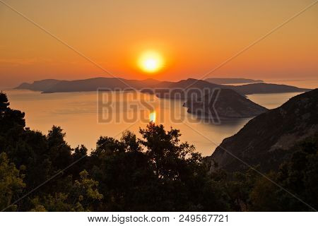 Aerial Sunrise Behind Alonisos Island From The Top Of A Hill In Skopelos, Greece